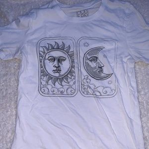 white shirt with sun and moon, in very good condition; barely warn